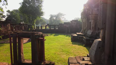 drone footage: low shot of an ancient temple in thailand at dawn