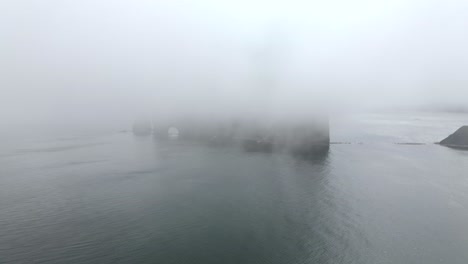 Perce-Rock-On-A-Foggy-Morning-By-The-Saint-Lawrence-Gulf-In-Quebec,-Canada