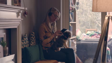 woman working on tablet with dog