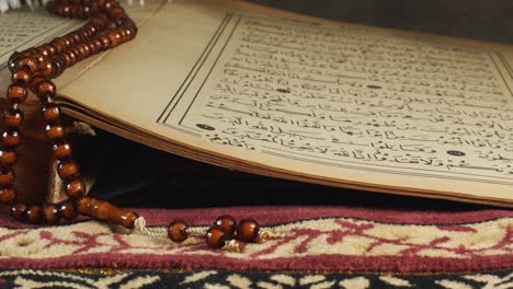 prayer beads on the quran page