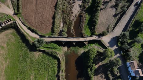 Top-down-view-of-the-Idanha-a-Velha-Roman-Bridge-from-a-drone