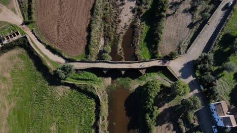 top down view of the idanha-a-velha roman bridge from a drone