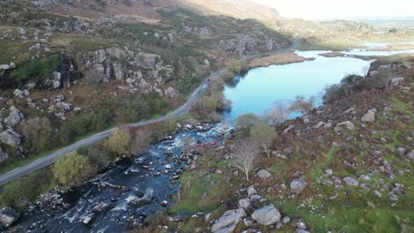 Wide-revealing-drone-shot-of-Gap-of-Dunloe,-Bearna-or-Choimín,-mountain-pass-in-County-Kerry,-Ireland