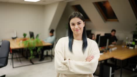 smiling modern girl standing at modern office coworking space