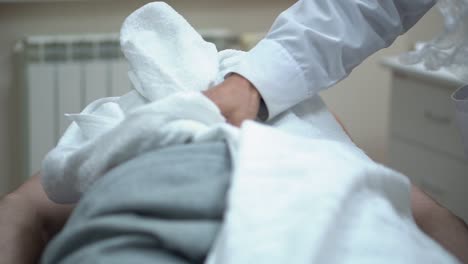 man receiving back treatment at a spa