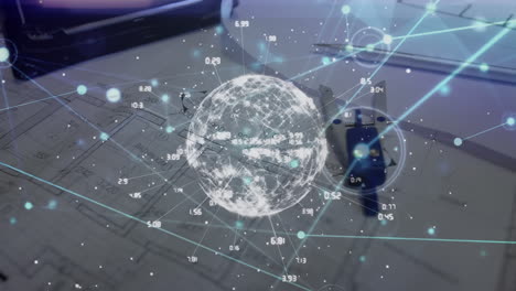 animation of globe with connections and data processing over desk