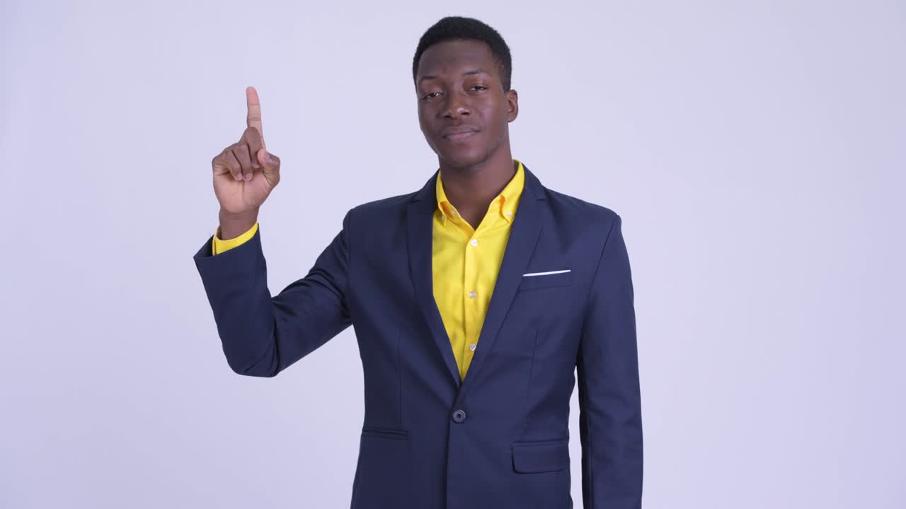 Young handsome African businessman in suit