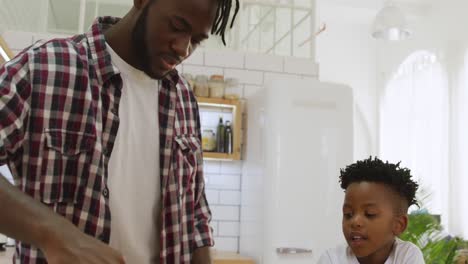 father and son cooking together