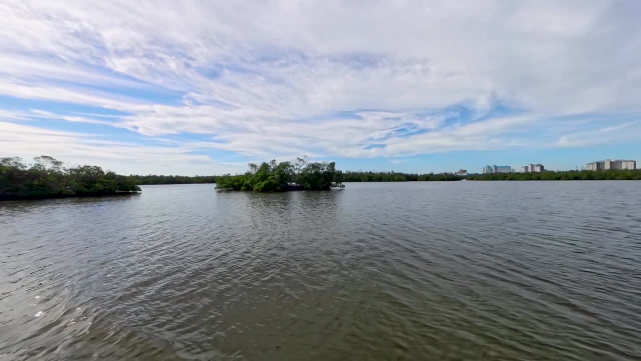 Taking a boat ride through the inlet on the way to Keewaydin Island to search for seashells.
