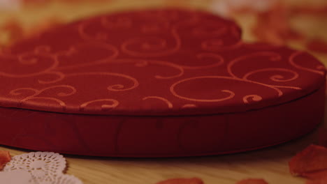 opening a heart-shaped chocolate box