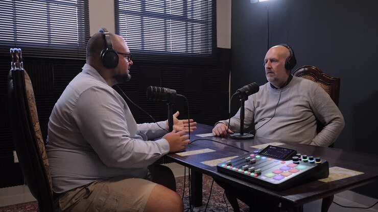 Two men recording a podcast in a studio
