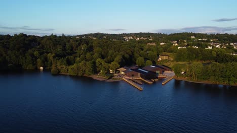 Overlooking-Windermere-Jetty-on-Windemere-Lake-near-Bowness-on-Windermere,-Lake-District,-UK,-during-golden-hour-evening-sunset