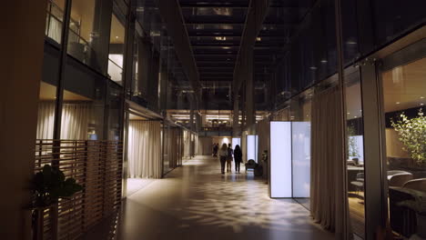 modern architectural corridor with people walking in a contemporary building
