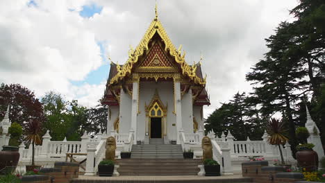 Zoom-in,-walking-towards-a-small-and-hidden-Buddhist-Thai-Temple