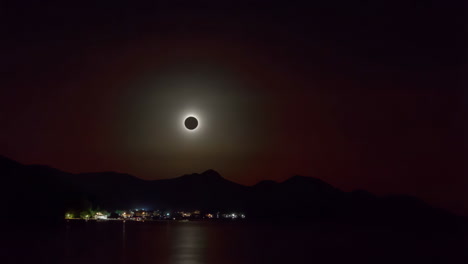 solar eclipse over a coastal city