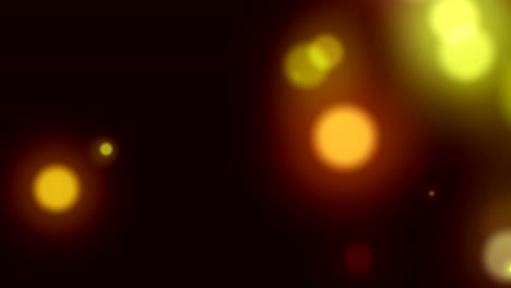 animación de manchas de luz amarillas brillantes que se mueven en movimiento hipnótico sobre un fondo negro
