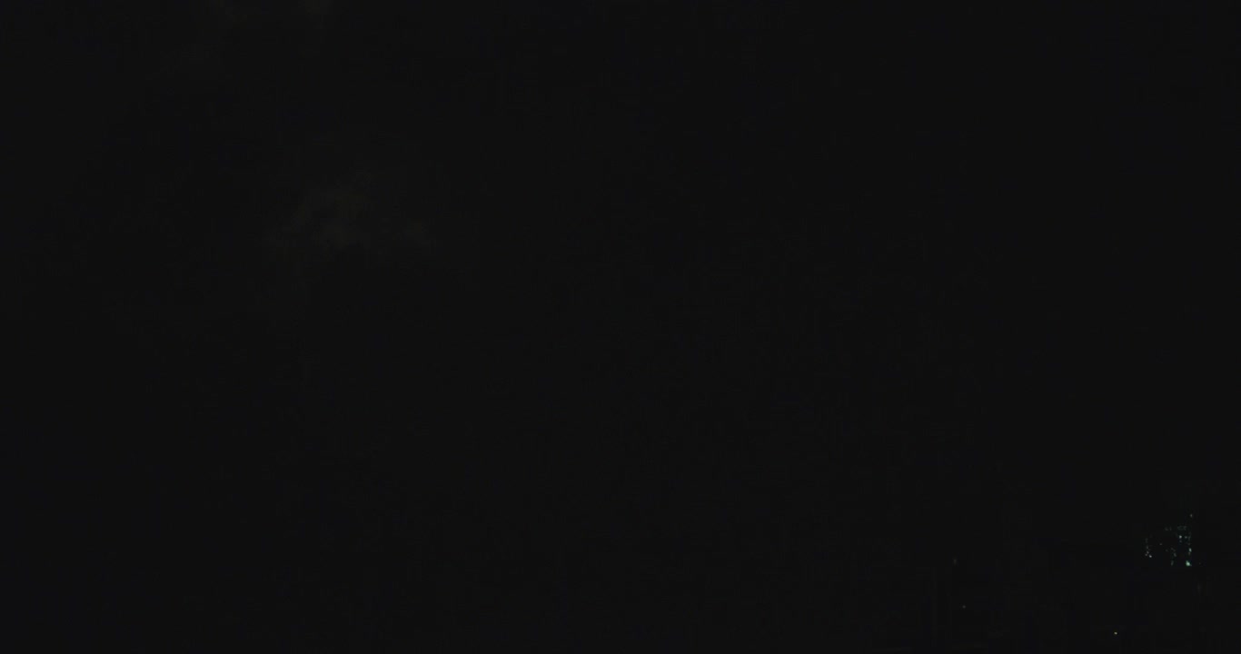 A series of large lightning strikes in thick clouds