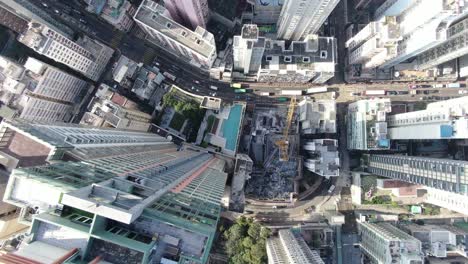 Downtown-Hong-Kong-city-skyscrapers-and-urban-traffic,-Aerial-view