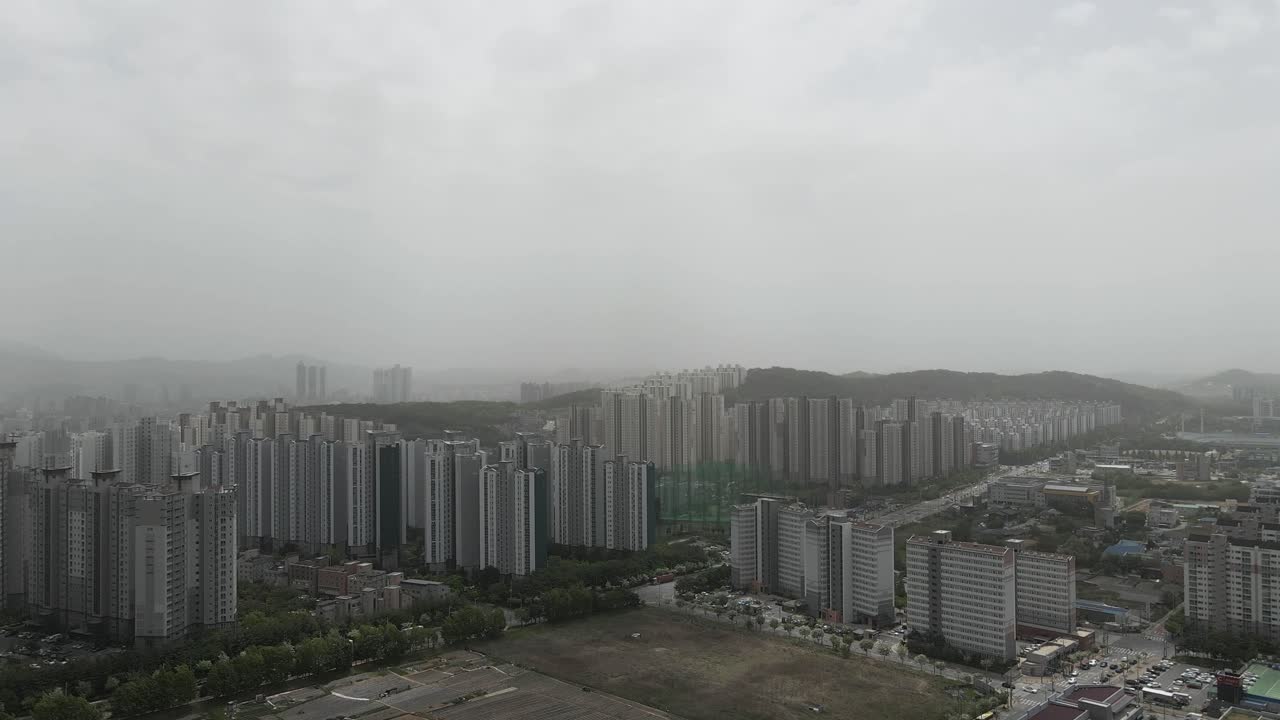 Aerial View of a Cityscape Shrouded in Haze