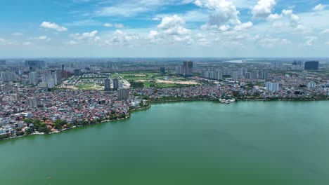 cinematic aerial footage of hanoi, vietnam, asia with the tay ho lake in the foreground, shot on a mavic 3 classic in 4k, drone