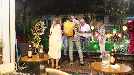 group of tourists conversing near a decorated area