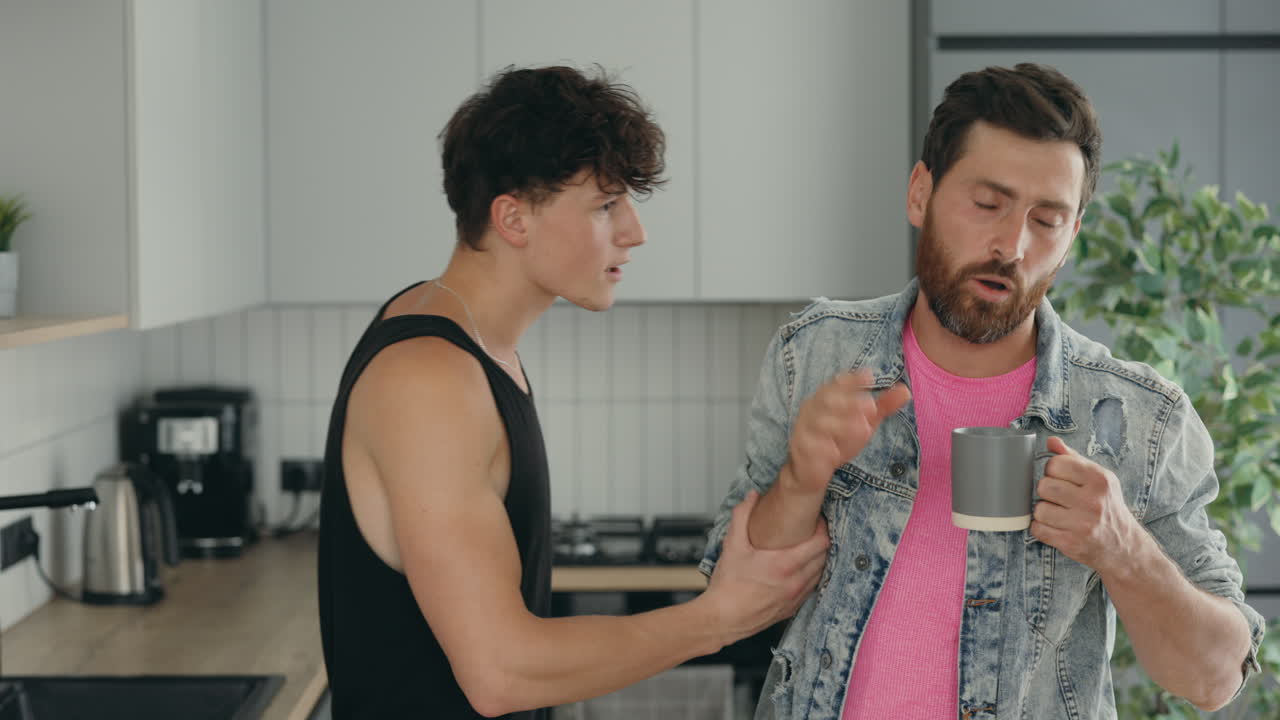 Brothers Arguing Over Coffee in the Kitchen