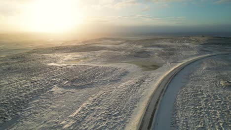 breathtaking sunset over snowy wintertime iceland landscape, aerial