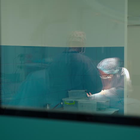 in surgery. medical team performing operation in hospital operating theater. working with surgical instruments.