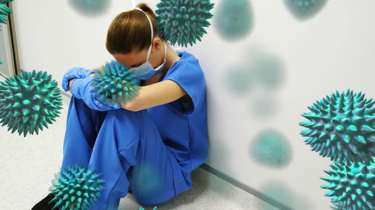 Animazione del coronavirus Covid-19 in diffusione con un operatore sanitario sullo sfondo.