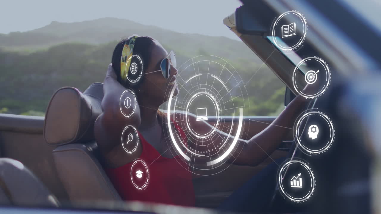 Driving convertible, woman interacting with digital animation icons in scenic view