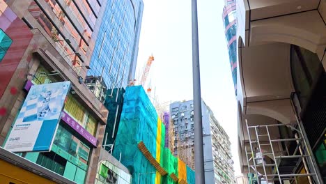 busy street with construction and scaffolding