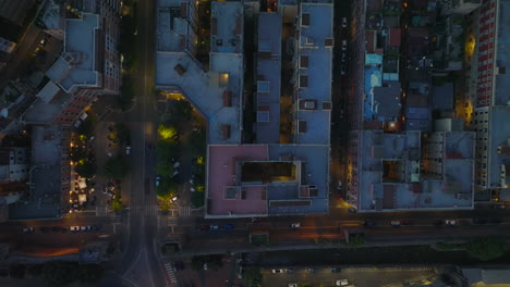 Blocks-of-multistorey-apartment-buildings-in-residential-urban-borough.-Top-down-shot-of-town-development-at-night.-Rome,-Italy