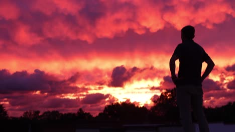 Lonely-Man-Watching-Sunset-At-Dusk-Youth-Depression-Travel-Slow-Motion