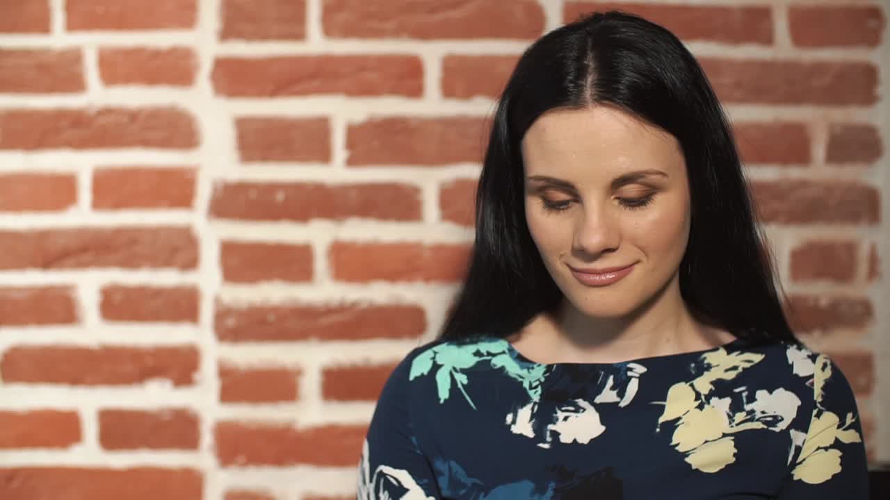 Couple in front of a brick wall