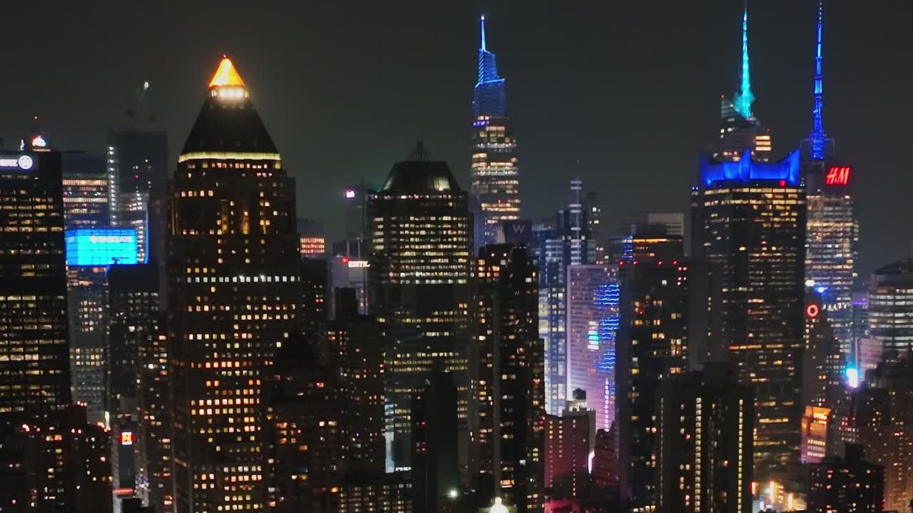 Spectacular aerial view of New York City skyline at night from a drone
