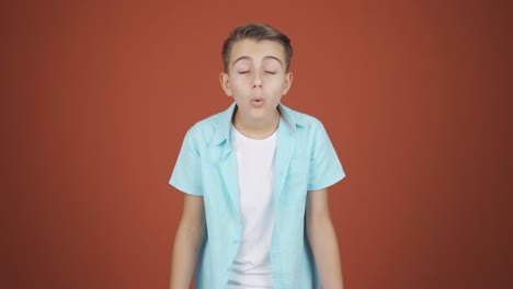 boy looking at camera in amazement.