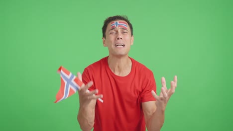 man cheering for norway during a match that is lost
