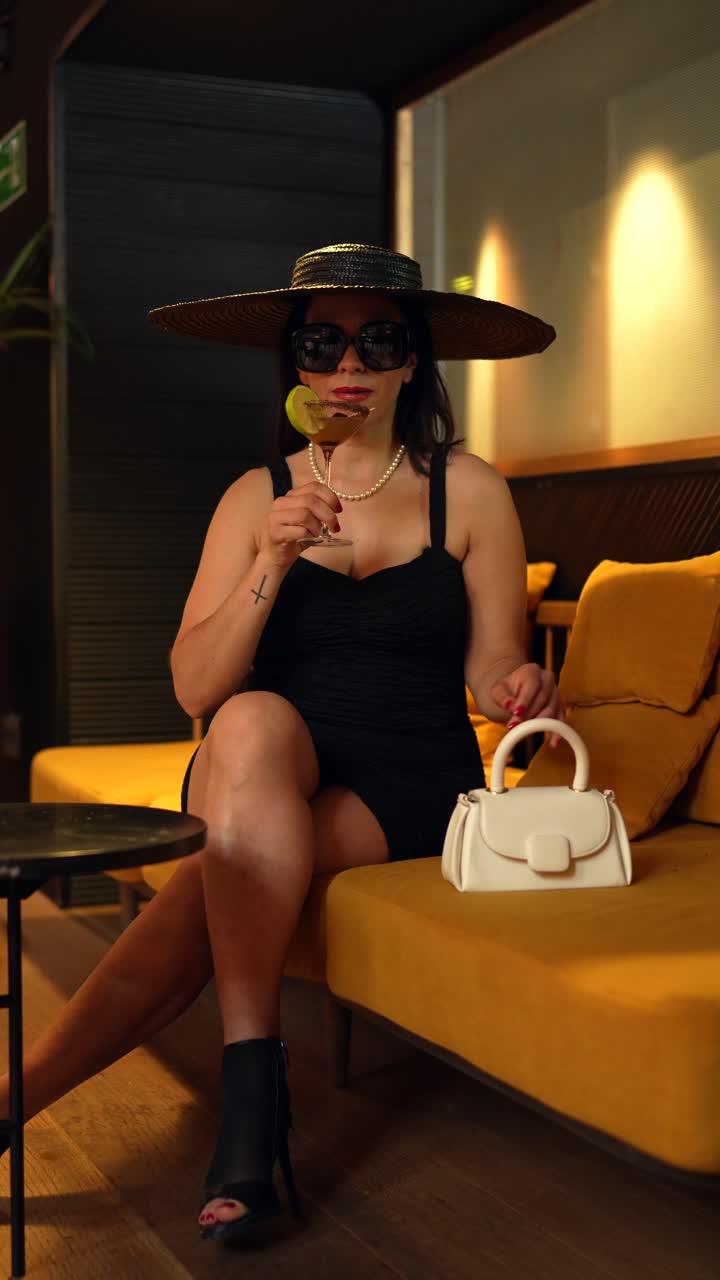 Elegant Woman Enjoying a Cocktail