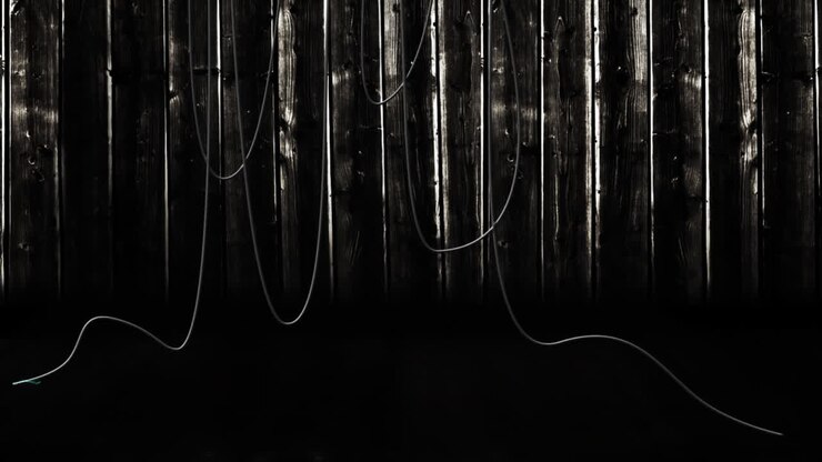 Animation of hanging cables and wooden boards on dark background
