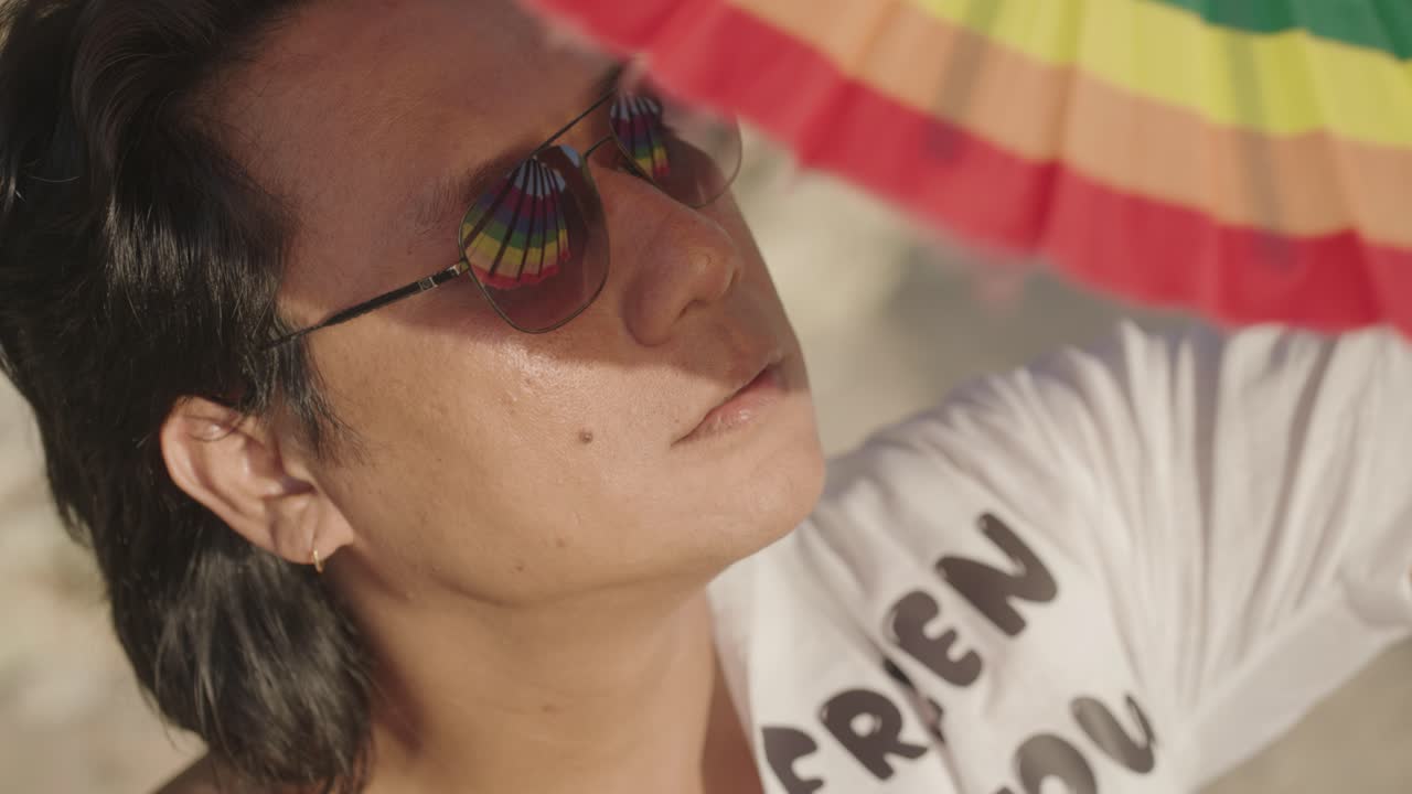 Man with Sunglasses and Pride Flag
