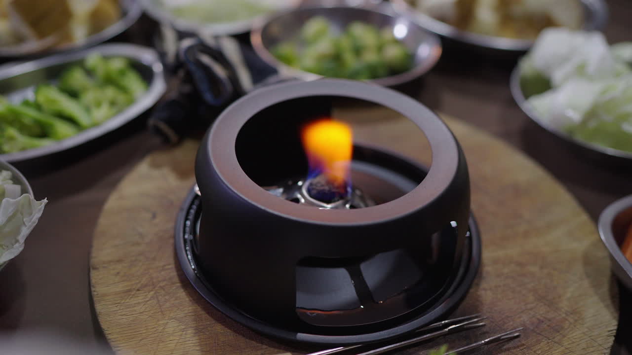 Table set with Bagna Cauda heater, rustic elegance in traditional Argentine food gathering