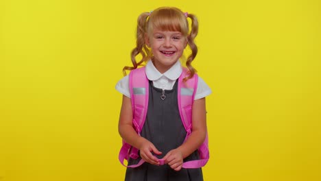 smiling school girl wear backpack laughing out loud after hearing ridiculous anecdote, funny joke