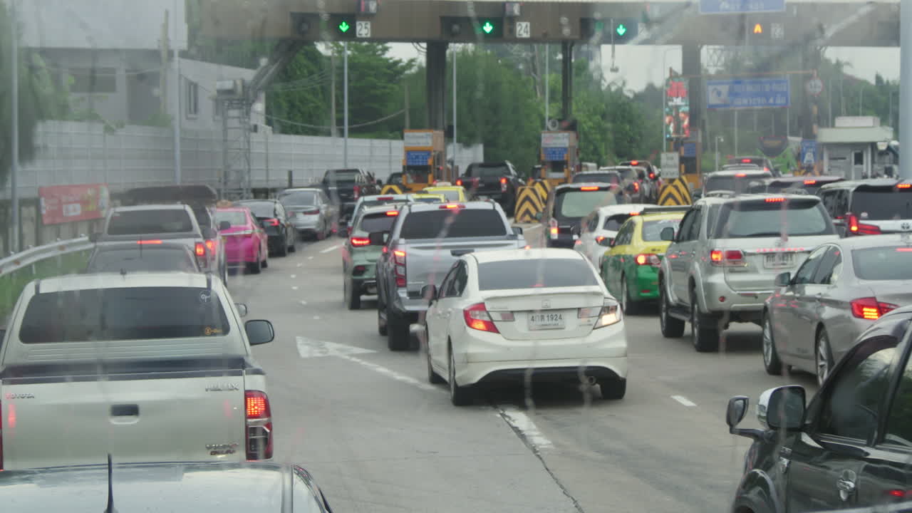 Traffic jam at a toll booth on a rainy day