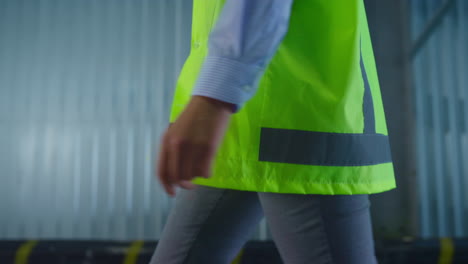 Closeup-warehouse-employee-uniform-wearing-walking-to-manufacture-workplace