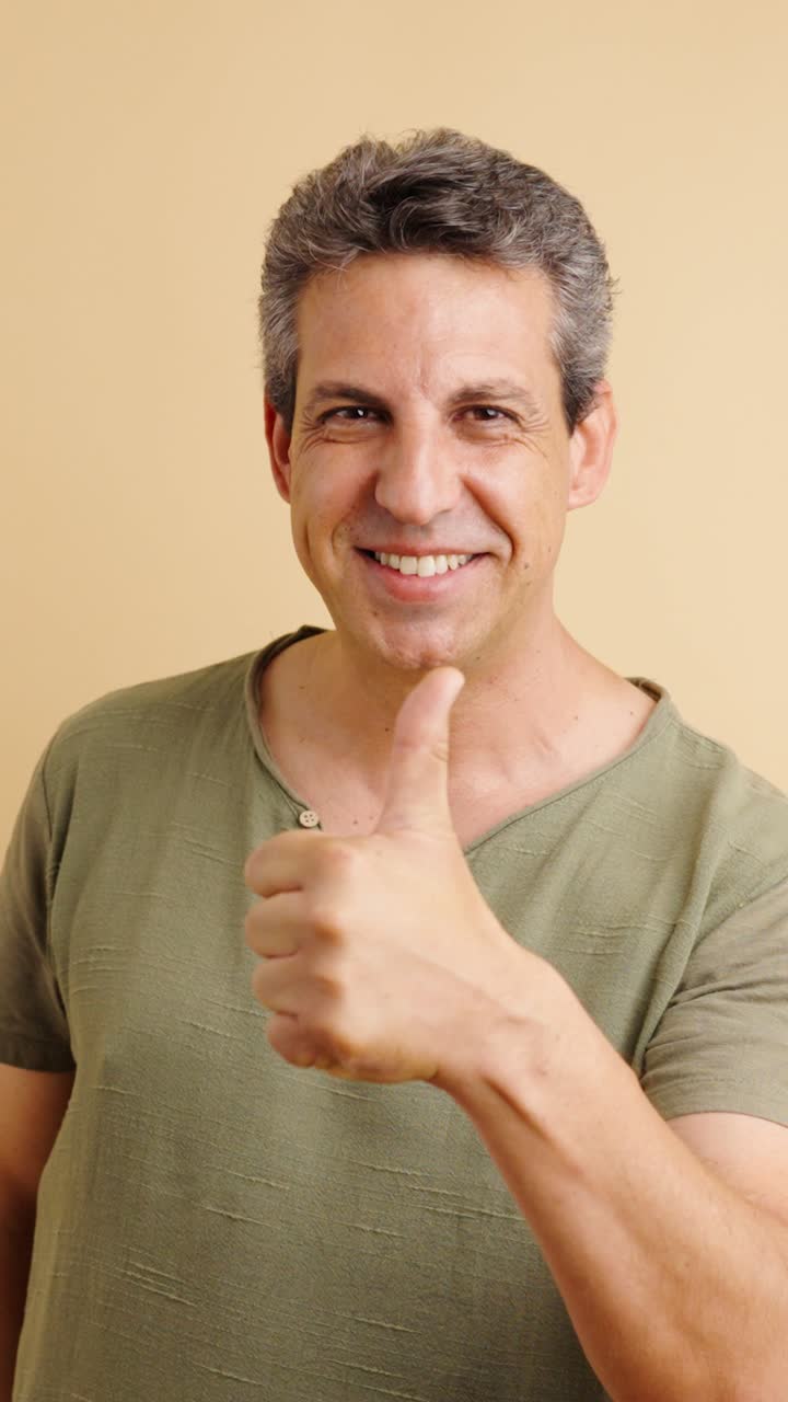 Portrait of a Man Giving Thumbs Up
