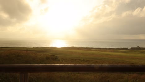 static timelapse shot of fistral beach with sunrays peaking through the clouds
