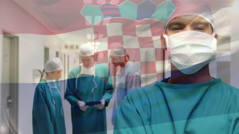 animation of flag of croatia waving over surgeons in operating theatre