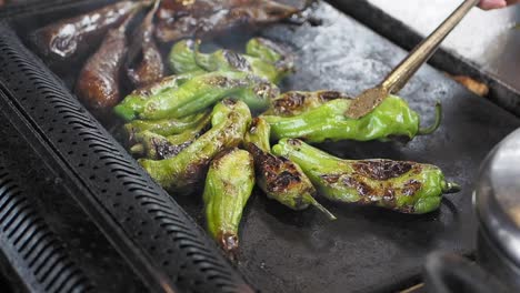 grilled green peppers on a griddle