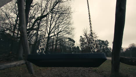 A-swing-eerily-swinging-by-itself-in-slow-motion