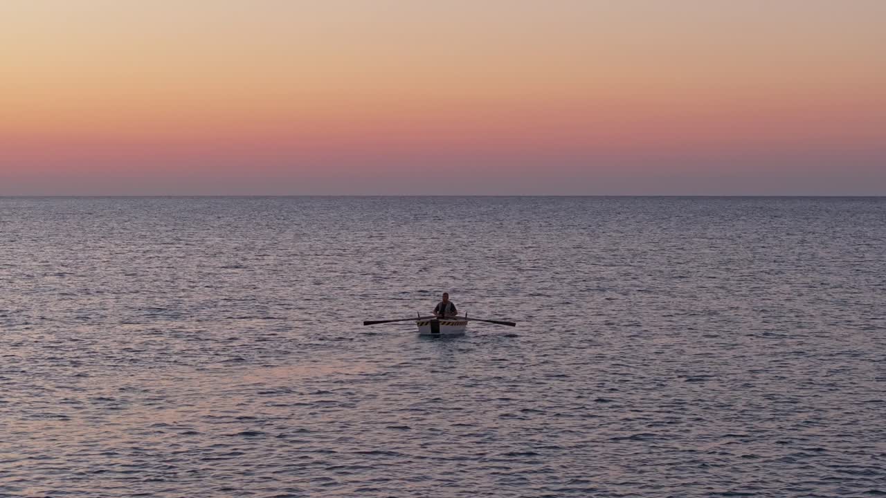 Aerial view of sunrise light on solitary boat in Mediterranean, Kizkalesi
